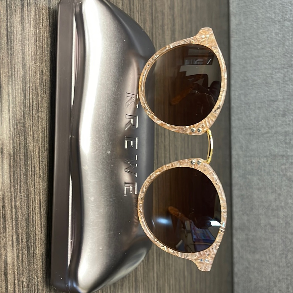 Krewe marbelized pink sunglasses.